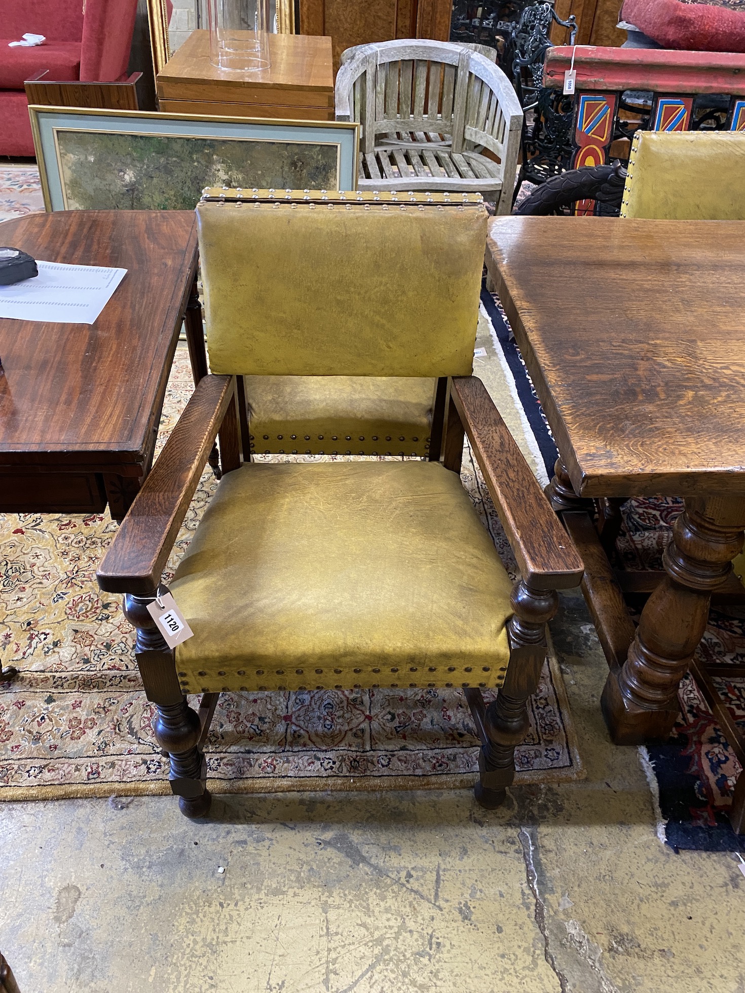 An 18th century style rectangular oak refectory dining table, length 224cm, width 92cm, height 77cm and eight dining chairs (2 with arms)